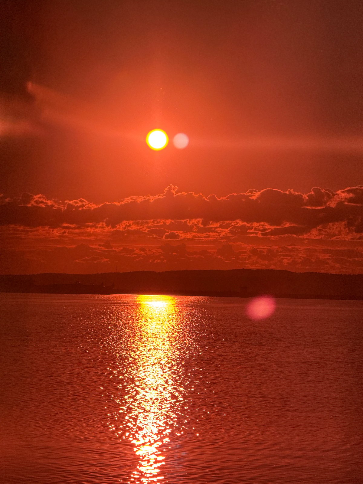 Golden hour sunset captured along Chaikovsky waterfront