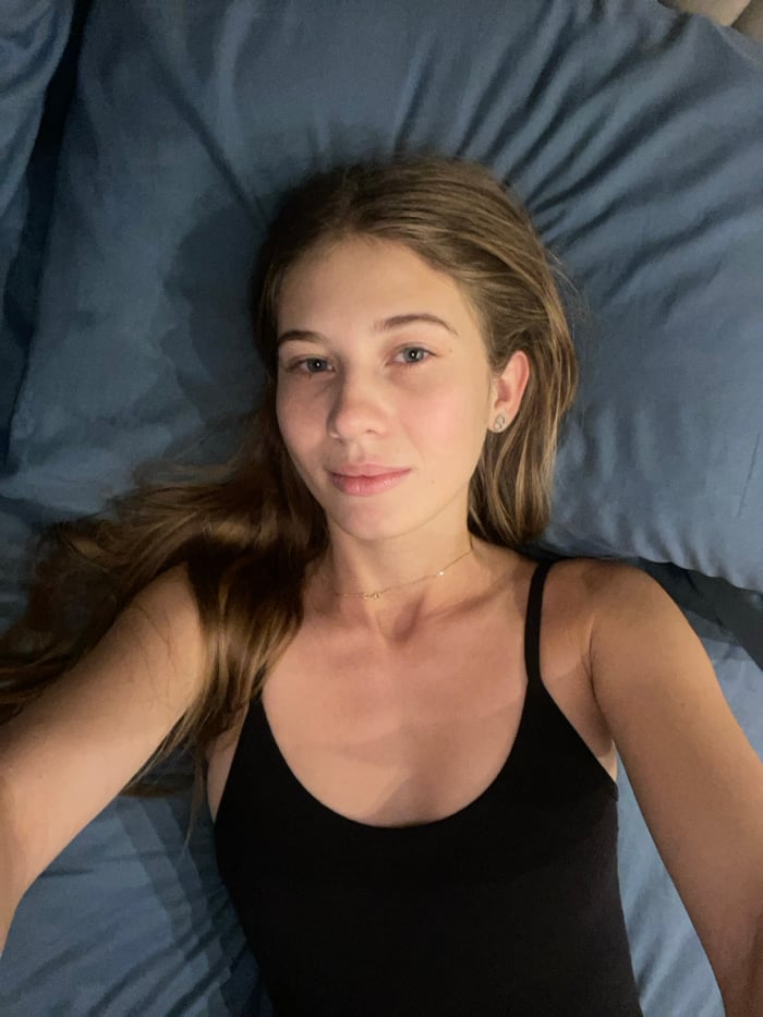 Woman photographed in multiple poses in Khimki bedroom