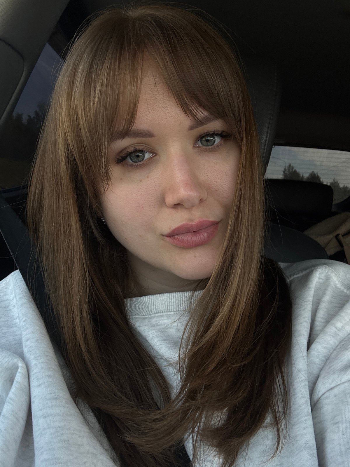 Woman takes car selfie in Егорьево, Russia