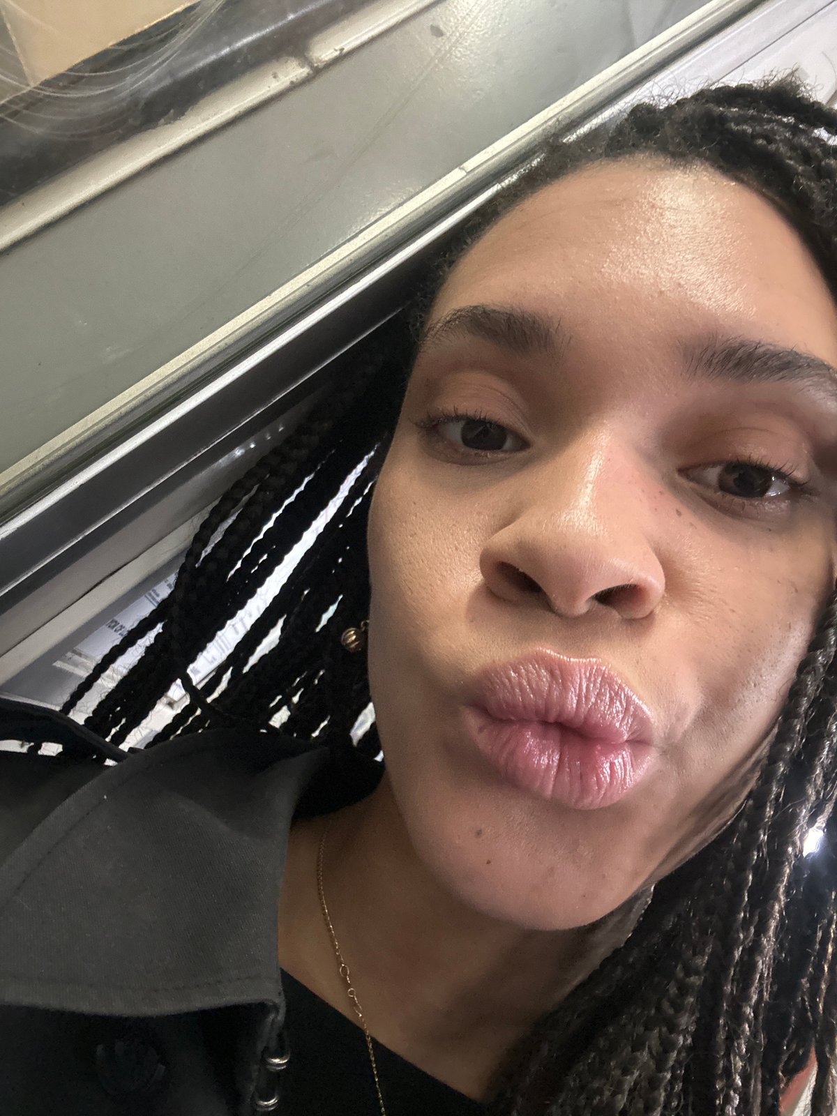Morning commuter takes playful selfie on London Underground platform