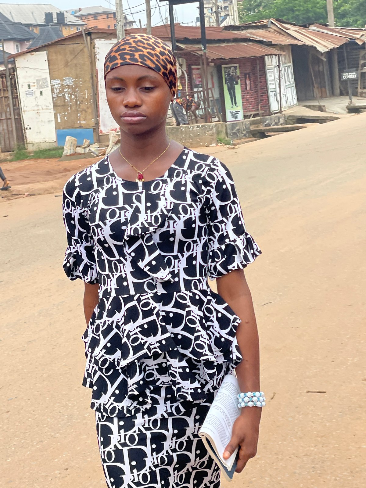 Morning street life captured in Nkpor, Nigeria neighborhood