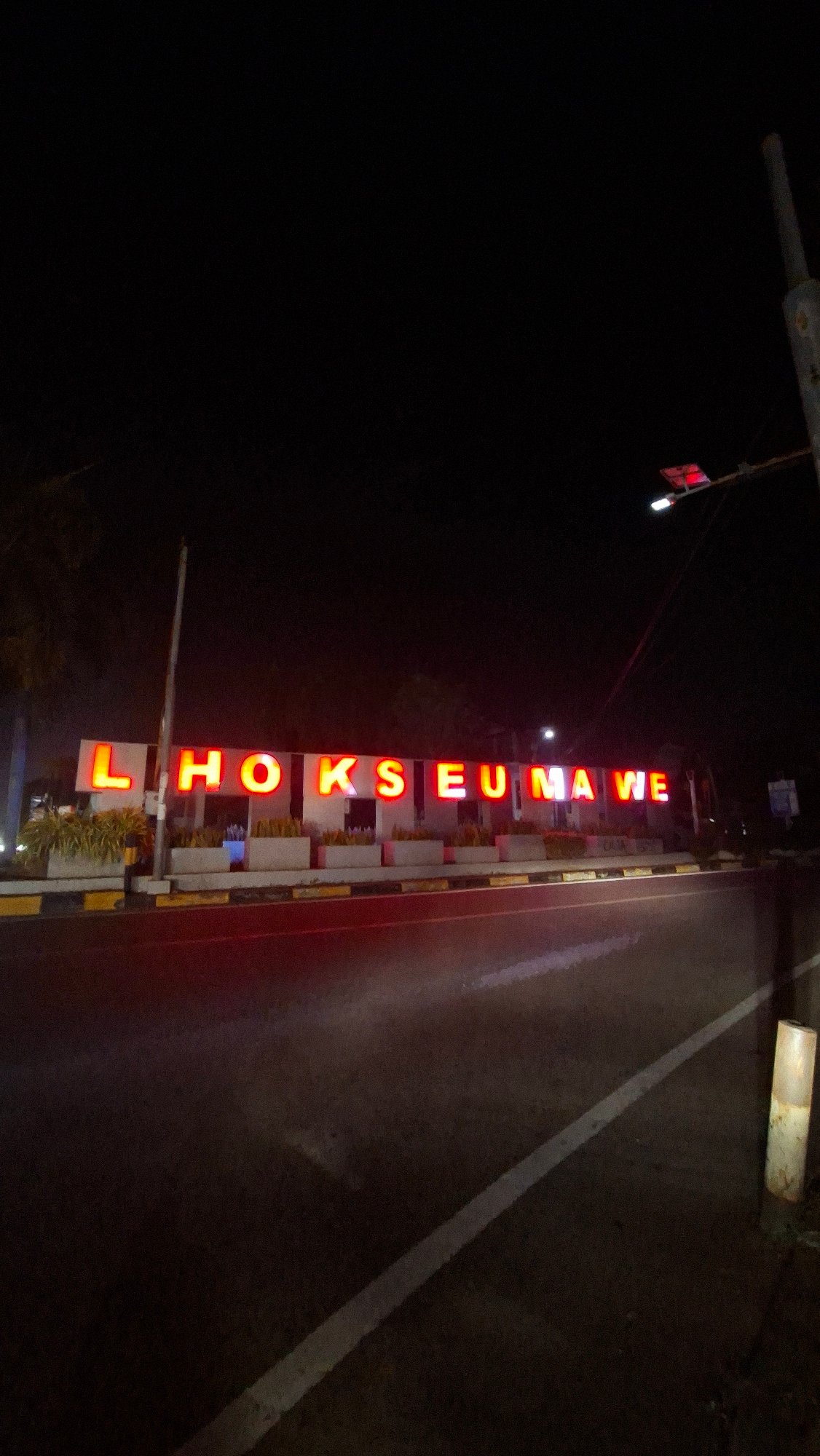 Lhokseumawe's colorful city sign glows at night
