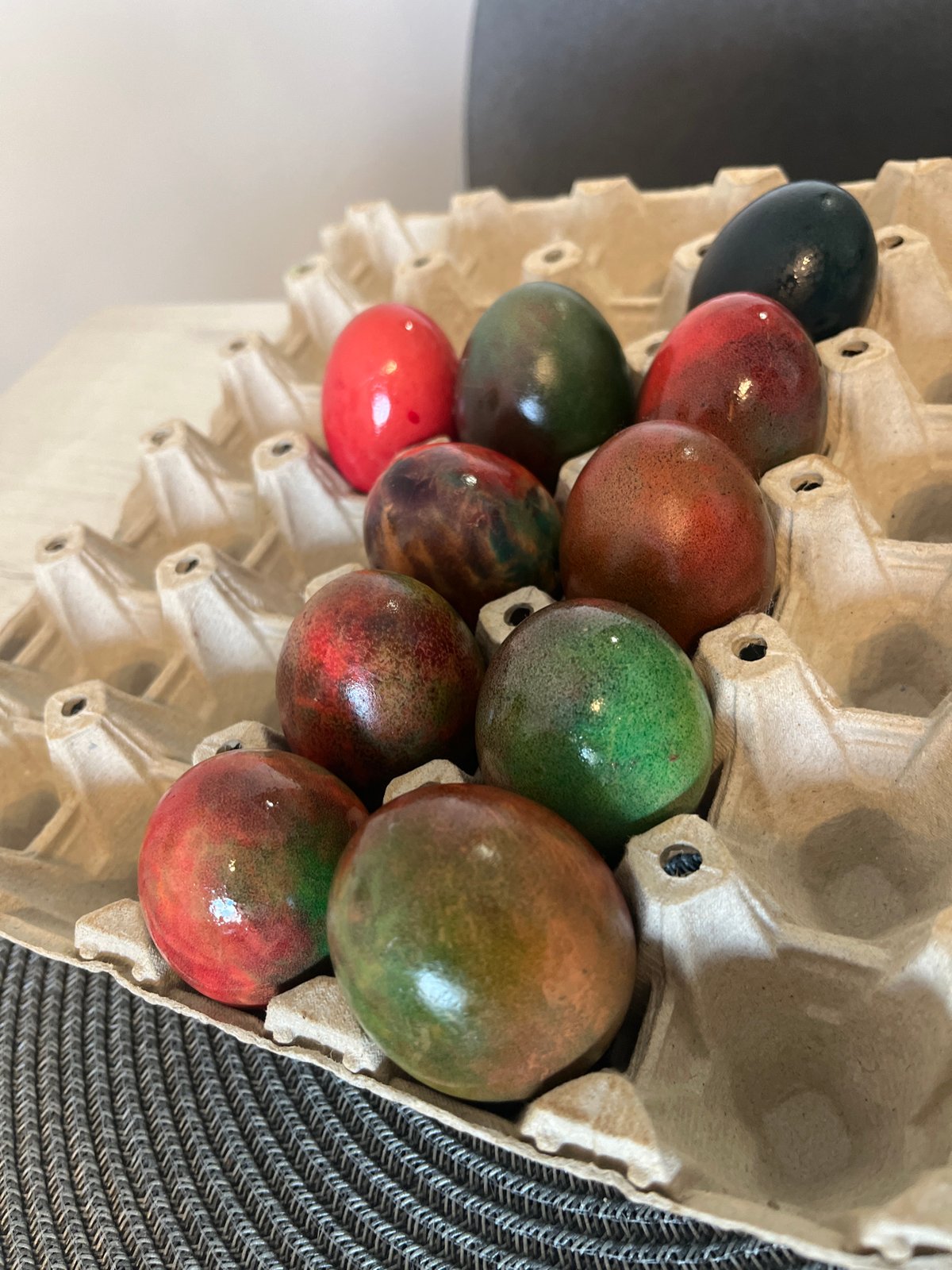 Colorful dyed eggs displayed in carton in Sofia