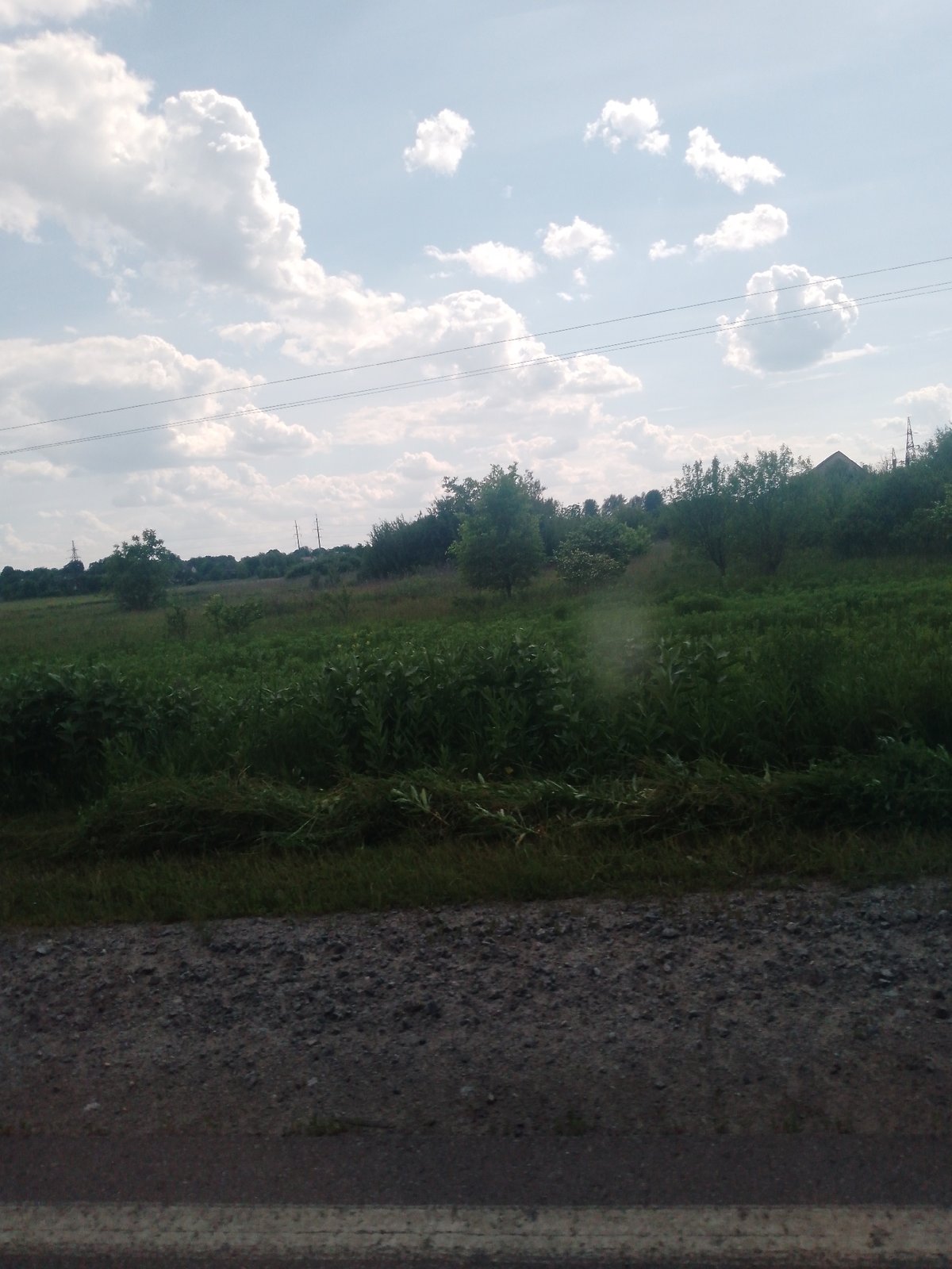 Rural road journey documented under cloudy skies June 6