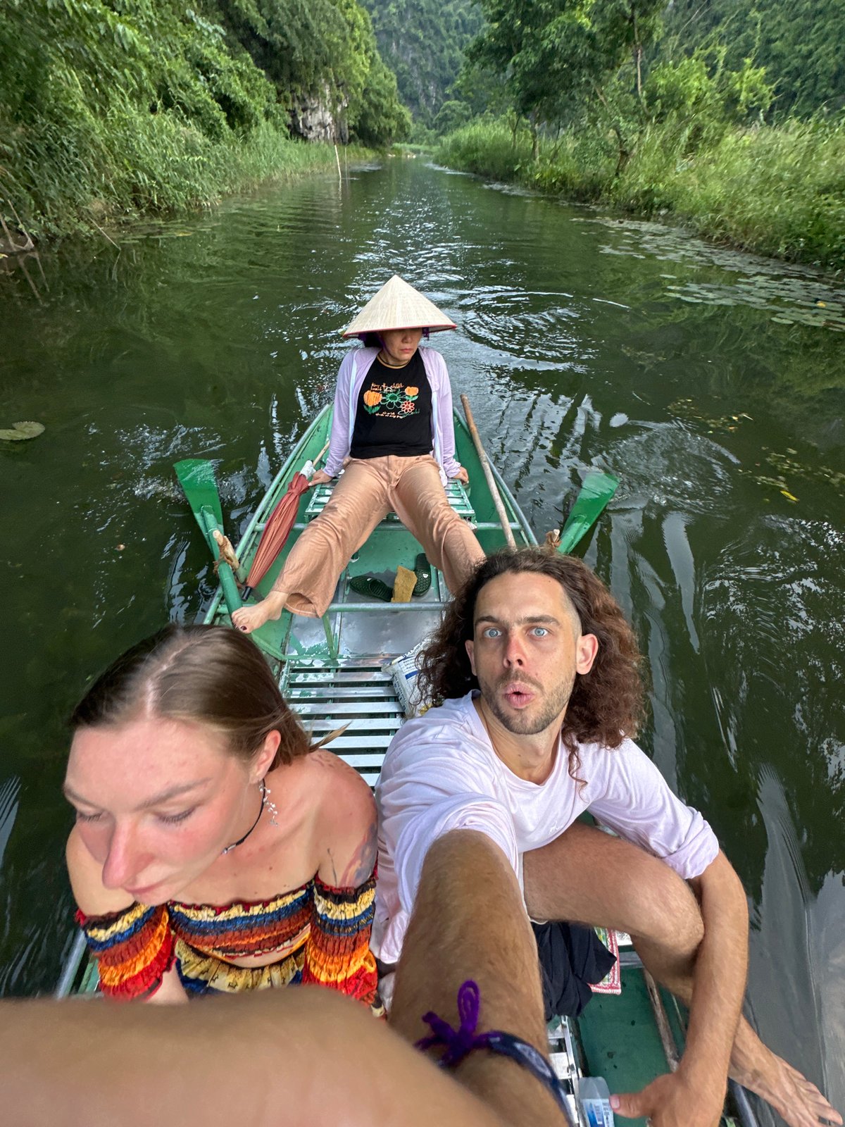 Tourists take scenic boat tour through Vietnam karst waterways