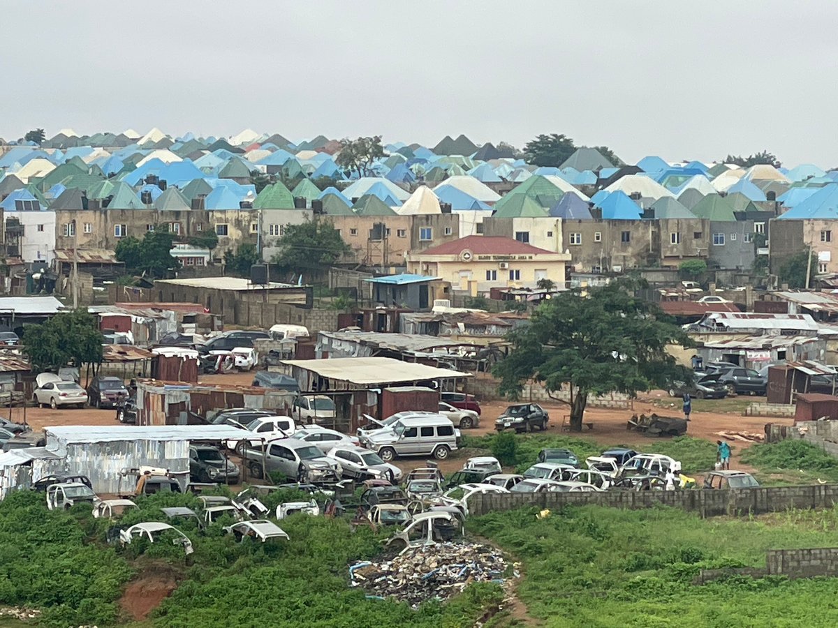 Abuja neighborhood mid-development, housing and construction side by side
