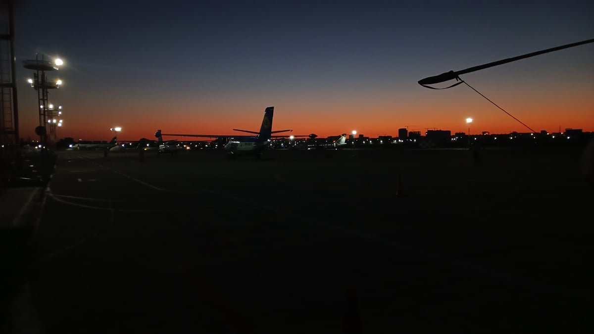 Tashkent airport tarmac at golden hour