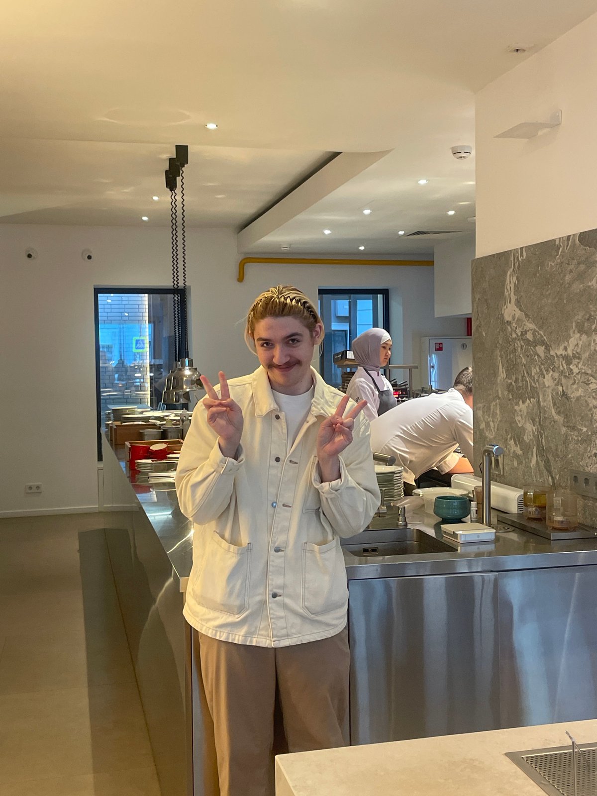 Young person spotted making peace sign in Moscow restaurant