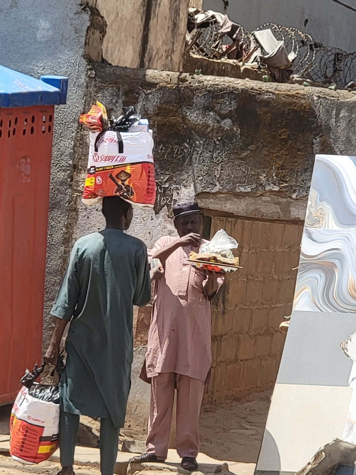 Daily street commerce documented in Maiburiji, Nigeria morning hours