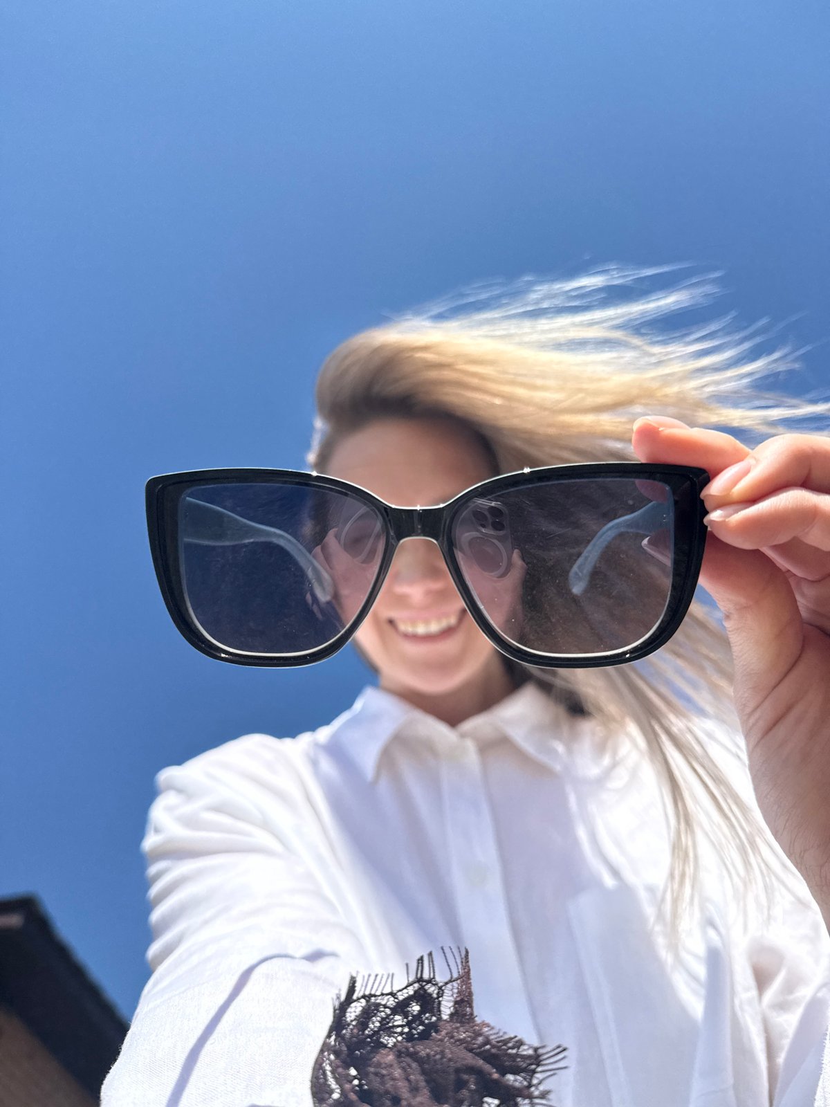 Woman poses for photos in sunny morning in Chaikovsky