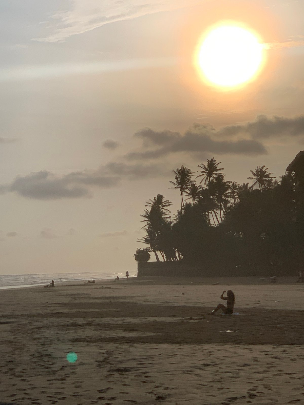 Person stands in water at Kathaluwa beach, Sri Lanka