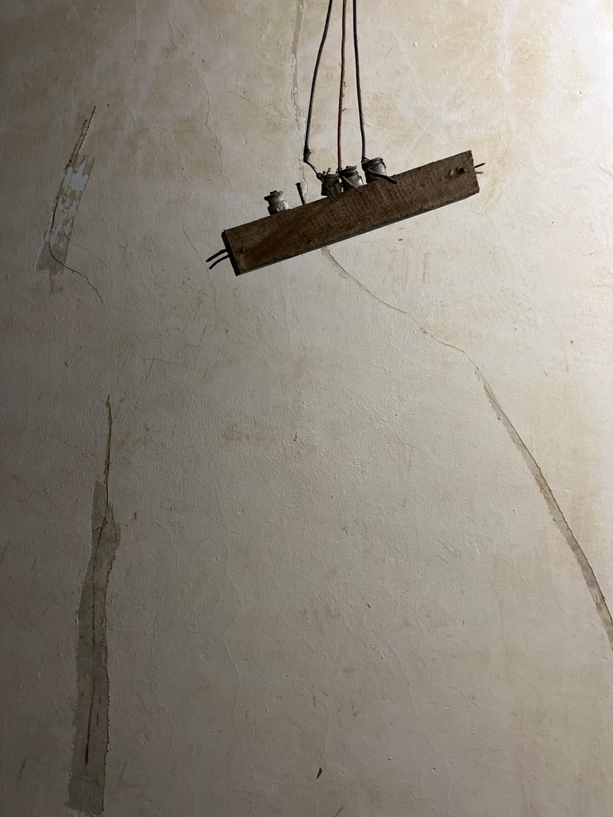 Inside a weathered Kota Kuala Simpang building, day into night