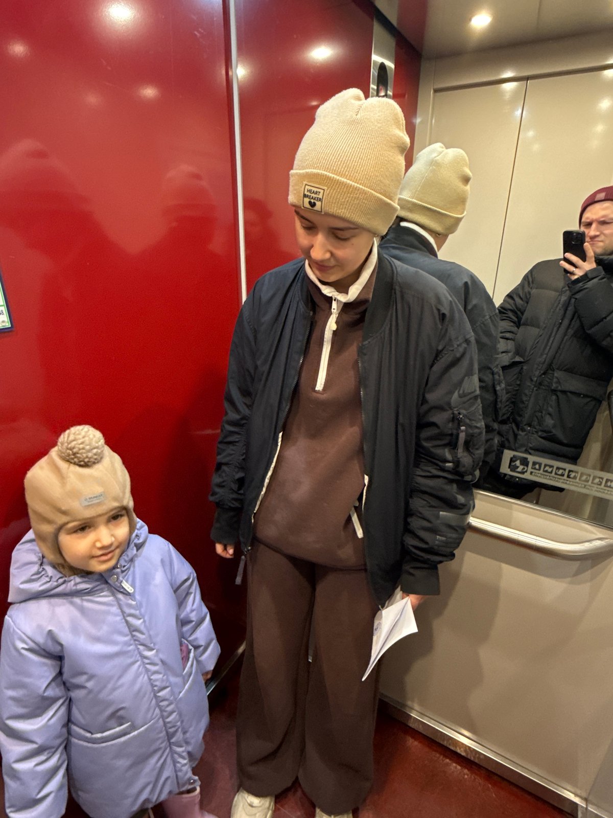 Late-night indoor activities captured in Krasnoyarsk elevator and hallway