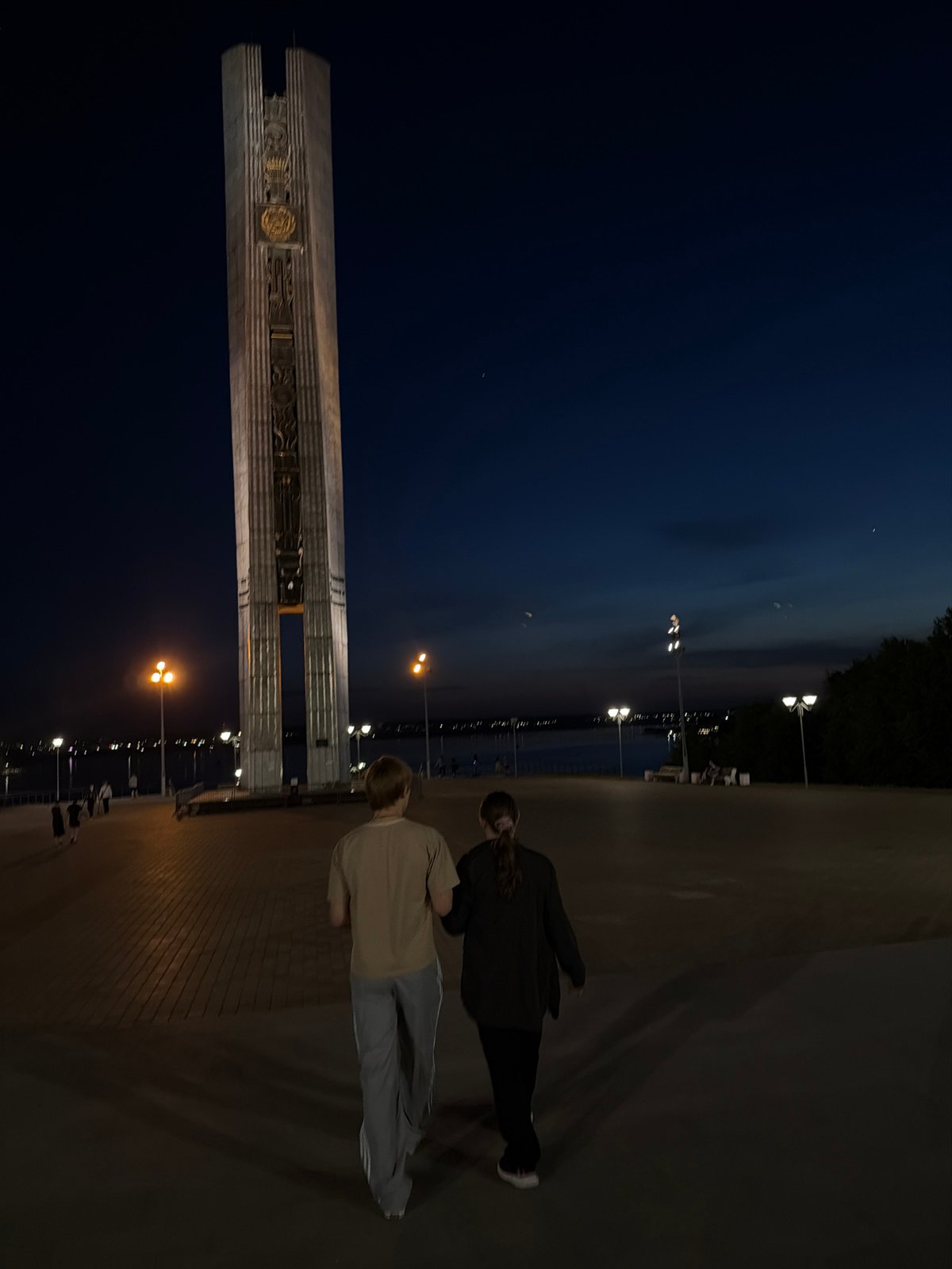 Evening visitors document landmarks across Izhevsk, Russia