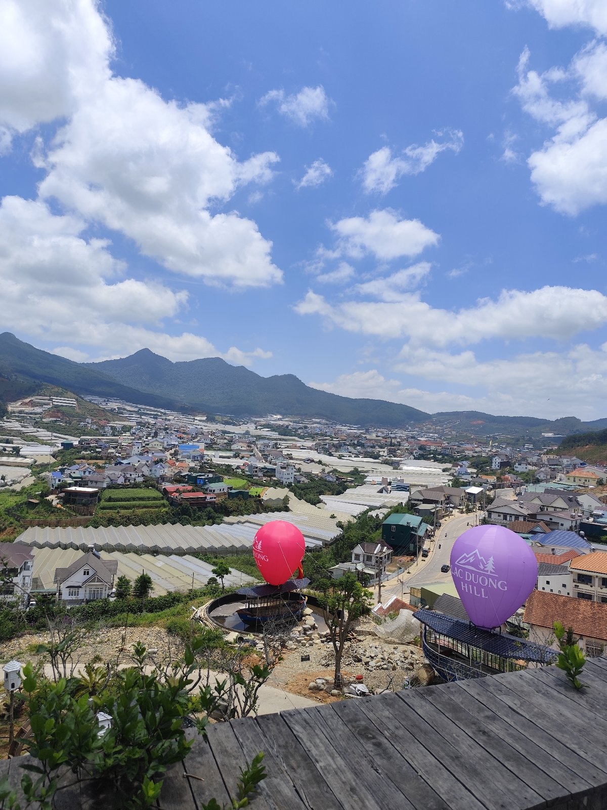 Wooden deck overlook captures Lạc Dương mountain town views