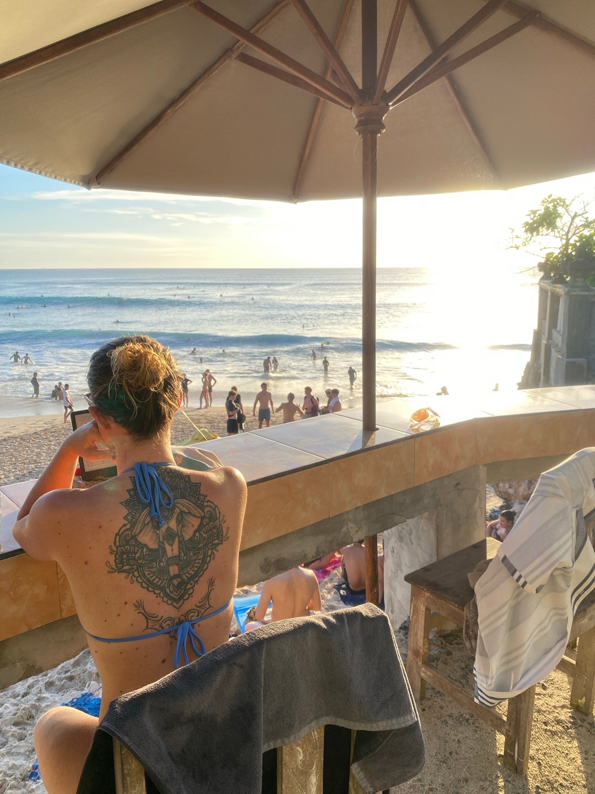 Beachgoers enjoy leisure time at Kuta Selatan coast