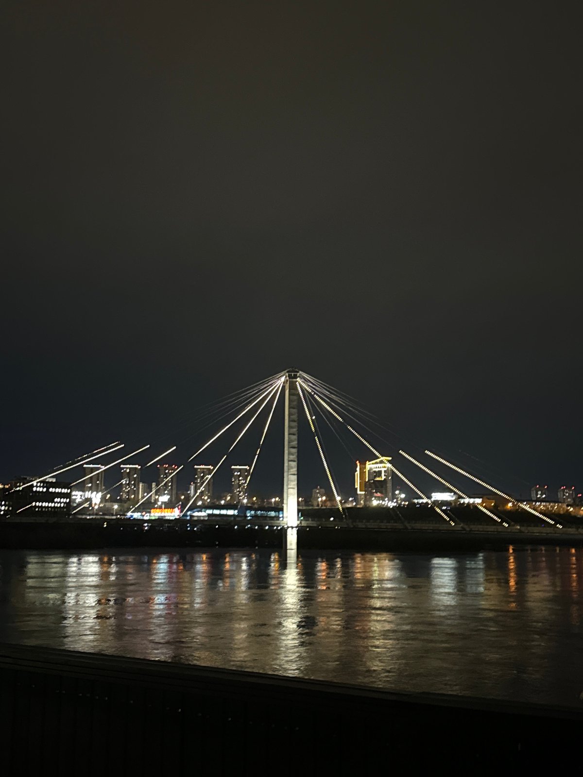 Nighttime illumination captured at Vinogradovsky Bridge, Krasnoyarsk