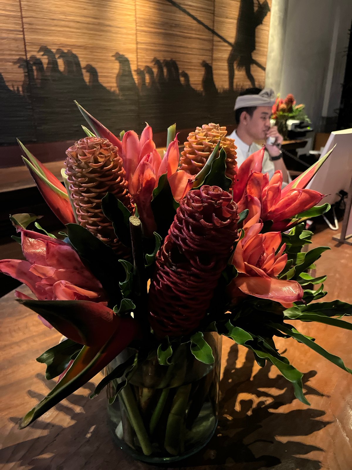 Rotated photos capture tropical flowers and lounge in Ubud