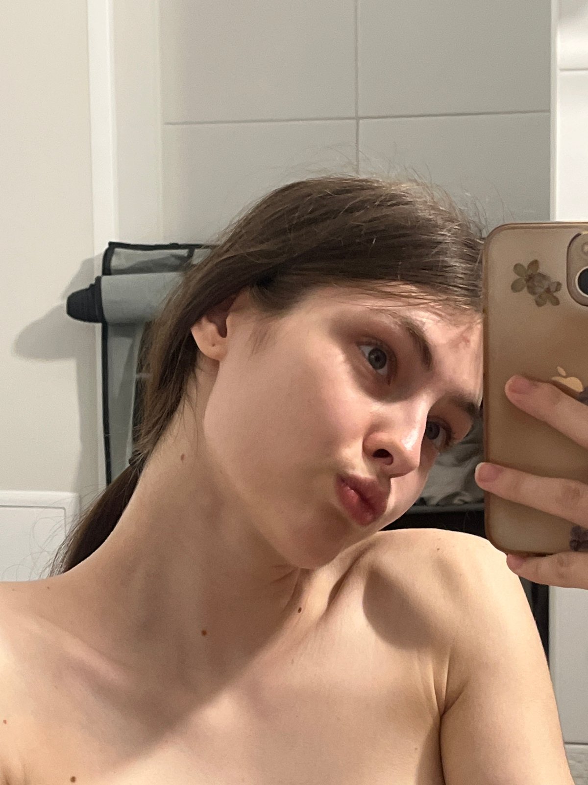 Woman takes mirror selfies in Saint Petersburg apartment