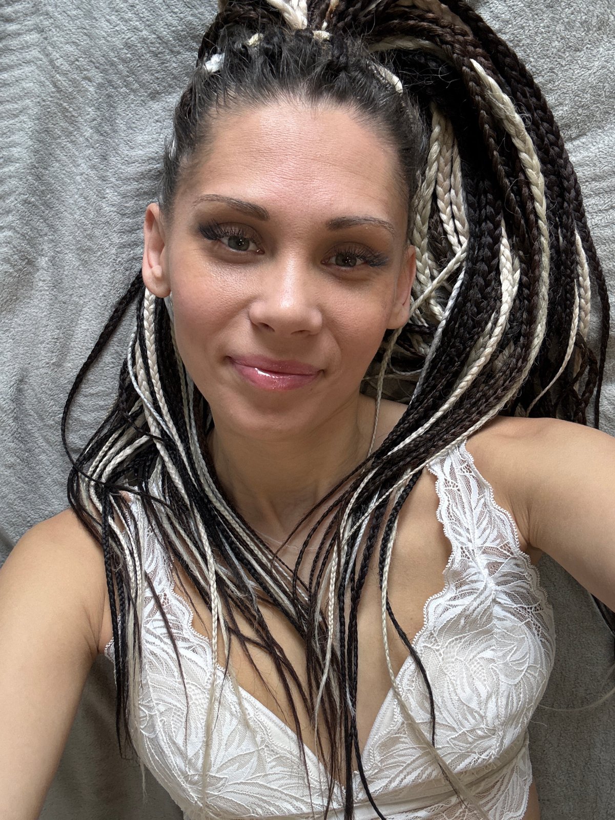 Woman with braids photographed smiling in Fedorino, Russia