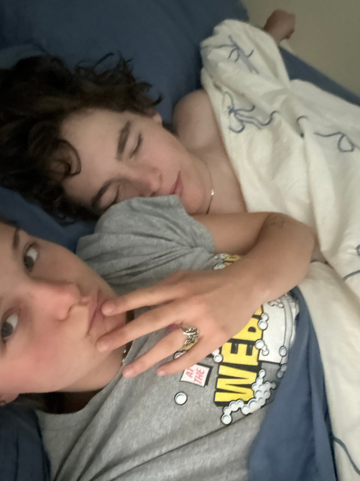 Two people rest together on bed in Whistler