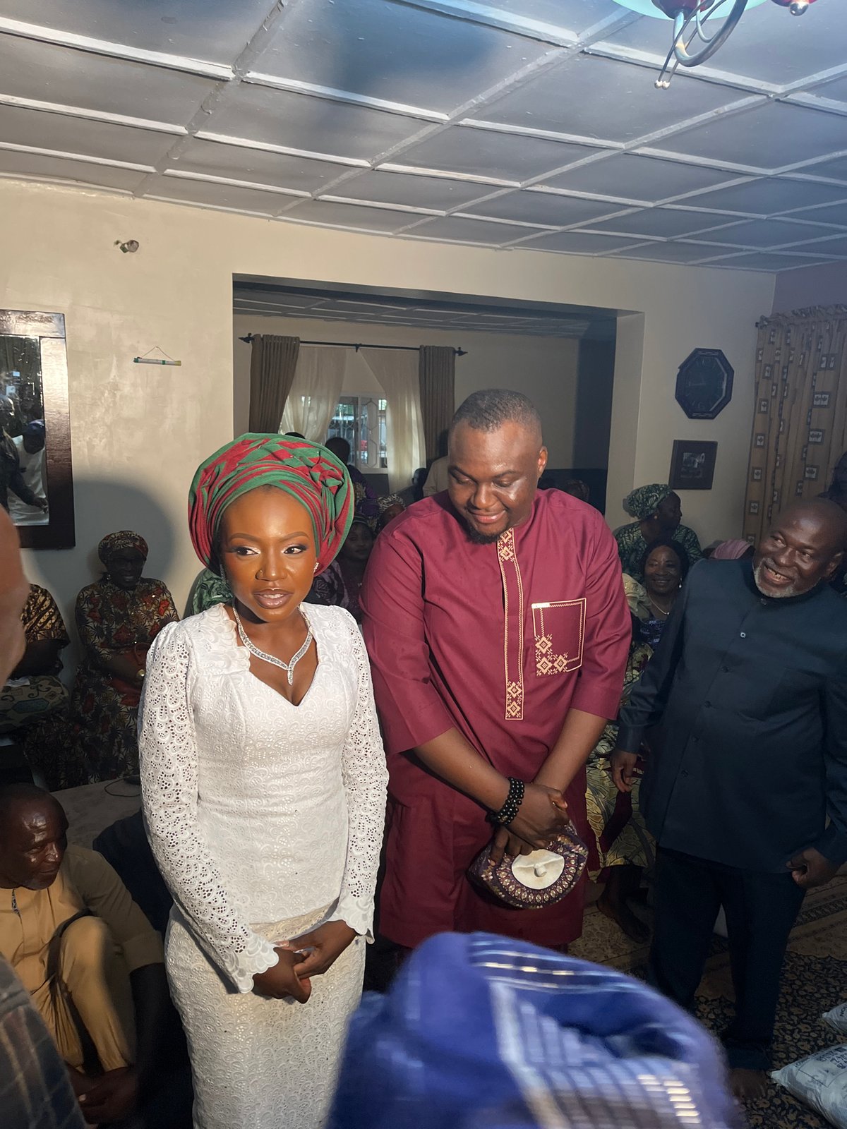 Community gathering with indoor meetings and supply distribution in Nigeria