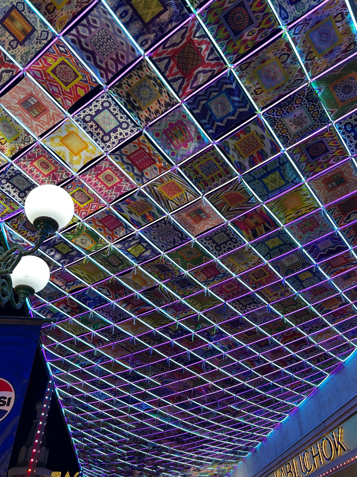 Illuminated pedestrian canopy draws crowds in Tashkent entertainment district