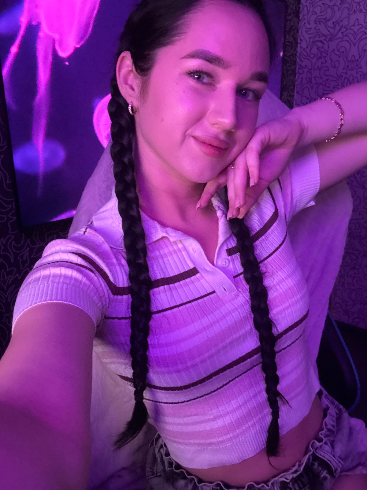 Woman documents makeup session, selfies in Novosibirsk bedroom studio