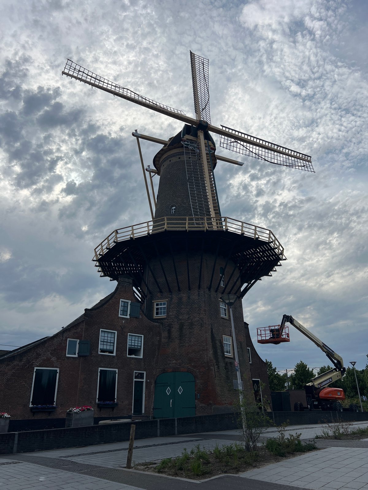 Windmill maintenance underway in Delft with cherry picker in action