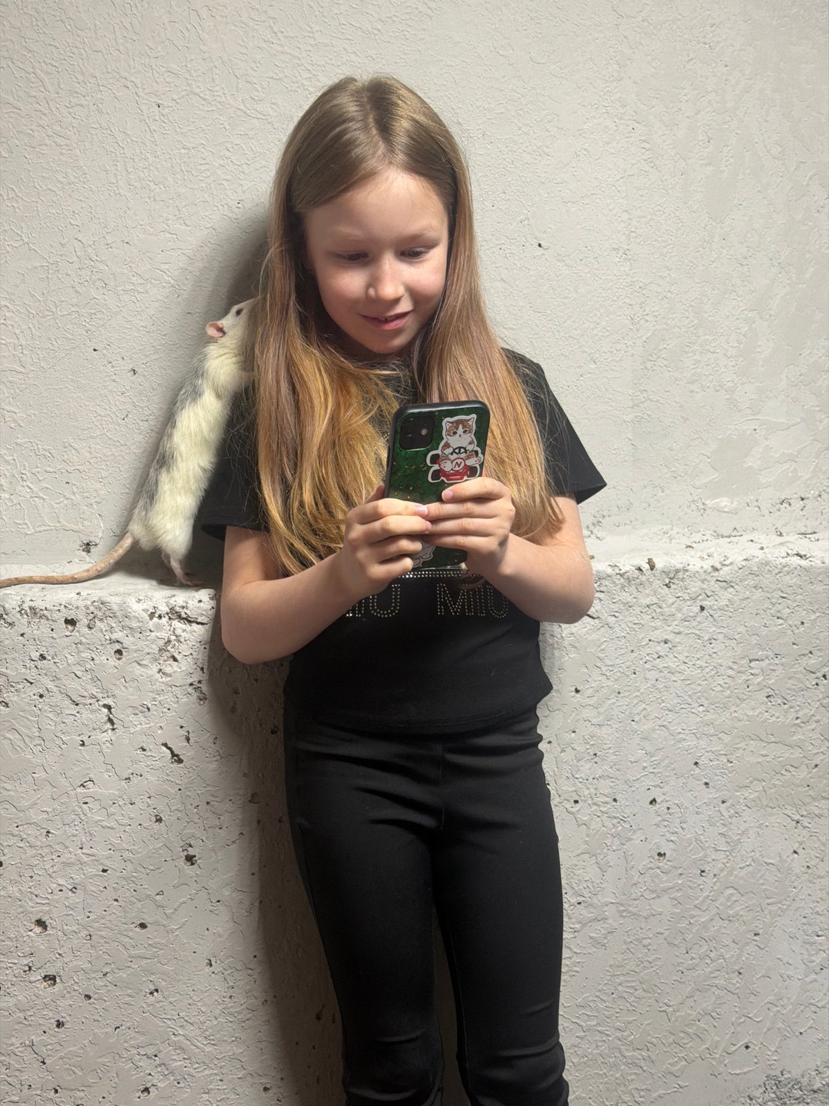 Girl plays with pet rats in Dubovaya home