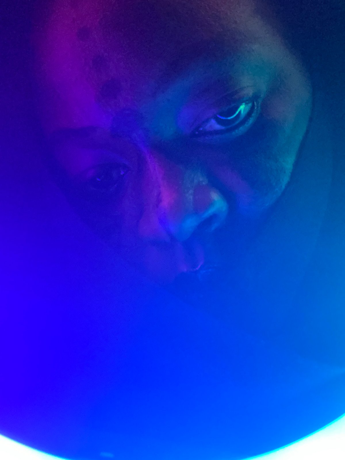 Person experiments with colorful ring lighting in Nigeria