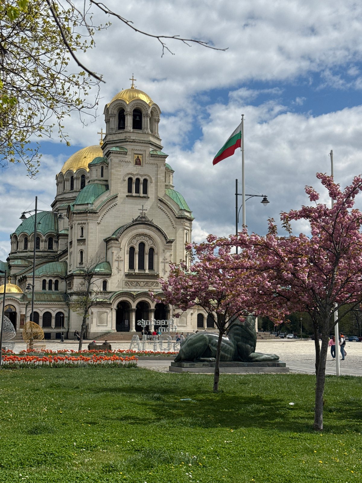 Spring blooms, pedestrians observed around Sofia's Alexander Nevsky Cathedral