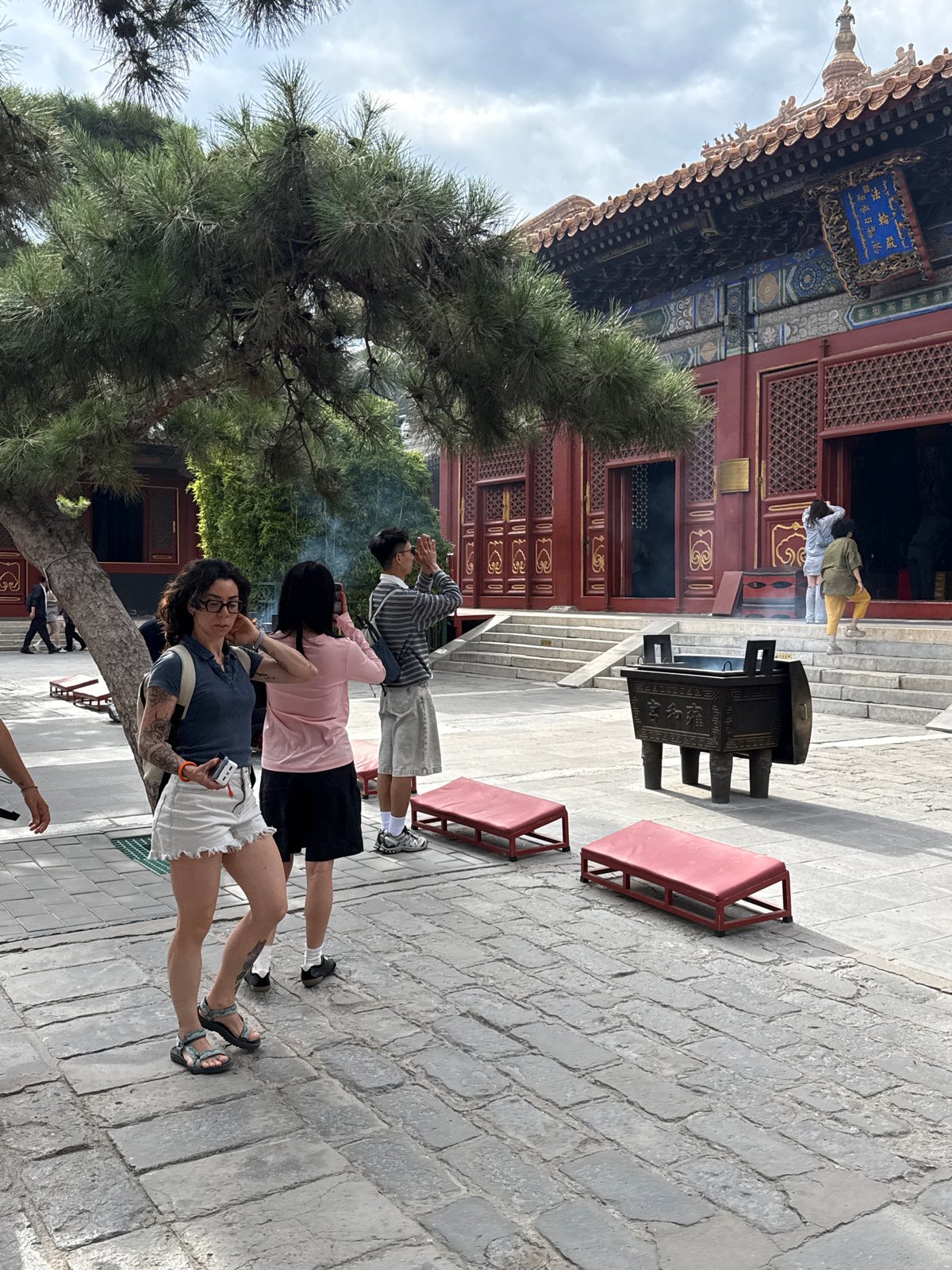 Temple visitors pray, light incense at Beijing historic site
