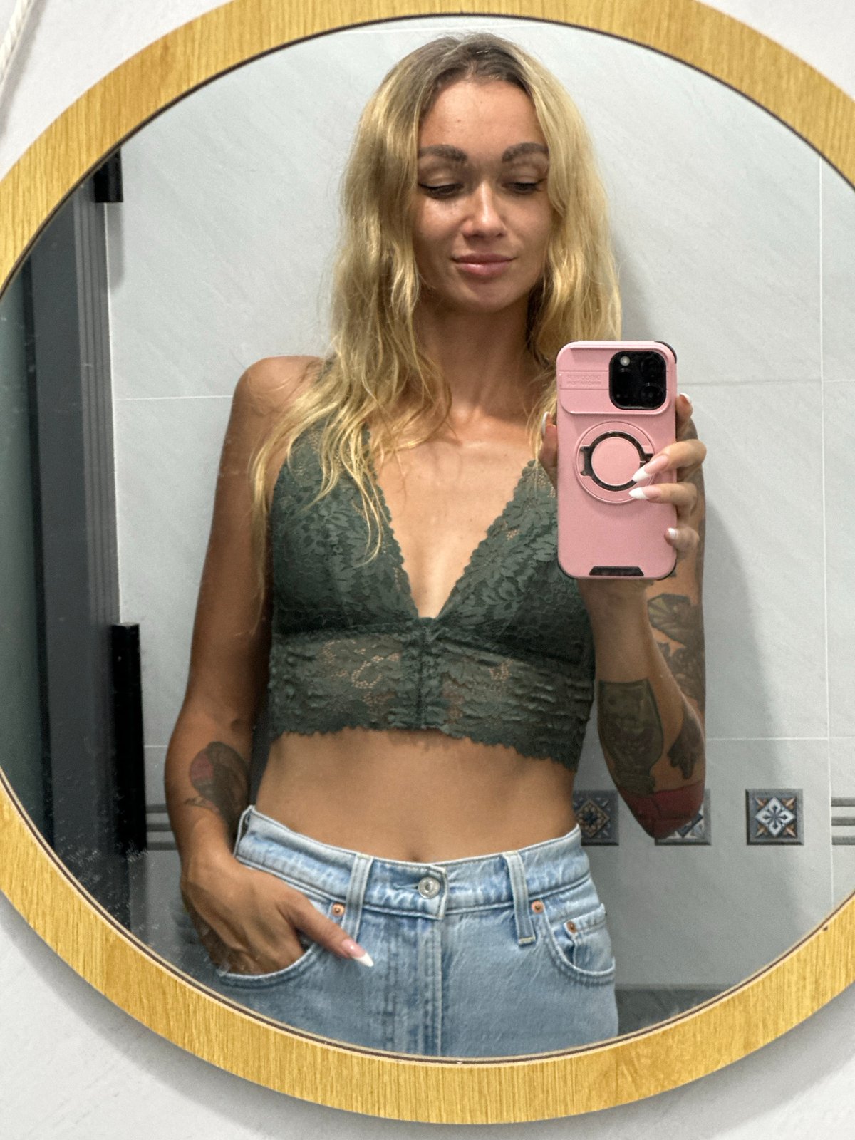 Woman Takes Mirror Selfies in Mũi Né Bathroom