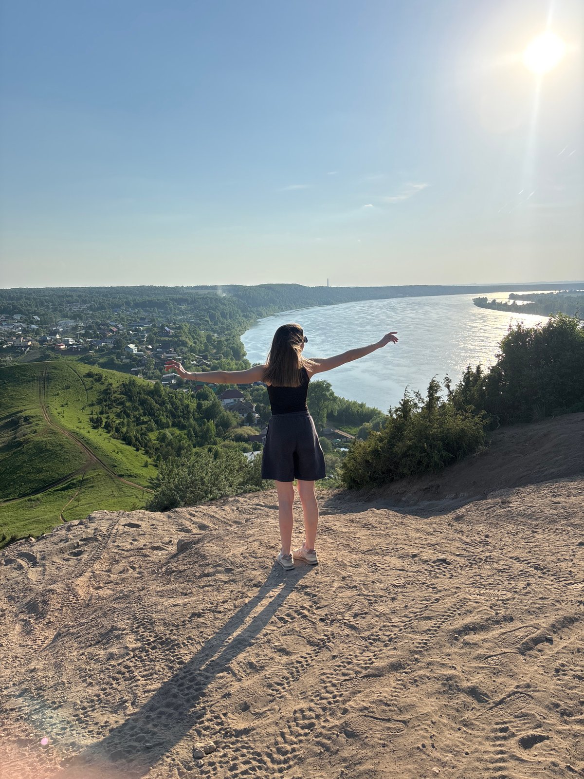 Two visitors explore scenic overlooks in Ольховка, Russia