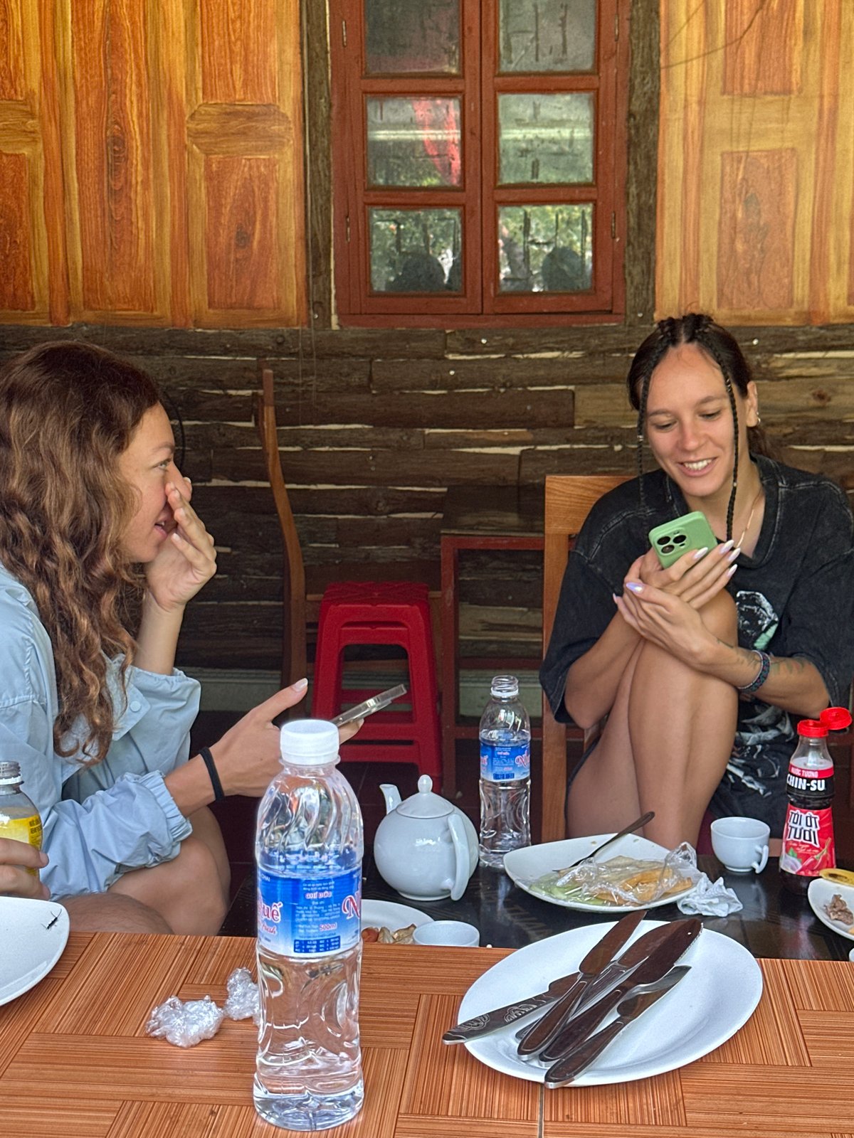 Tourists document dining and sightseeing in Vietnamese mountain commune