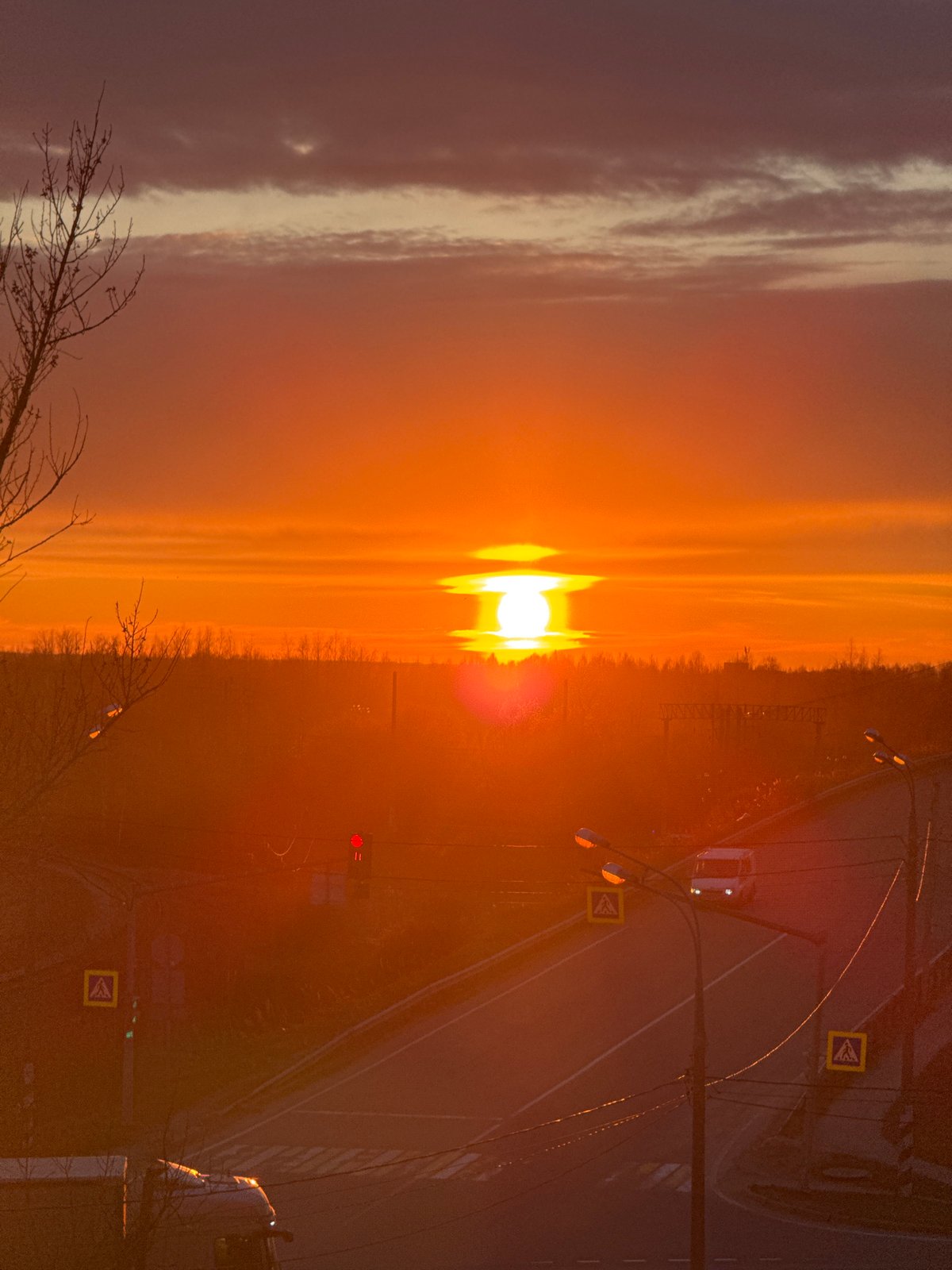Orange sunset observed over road intersection in Ново-Никольское