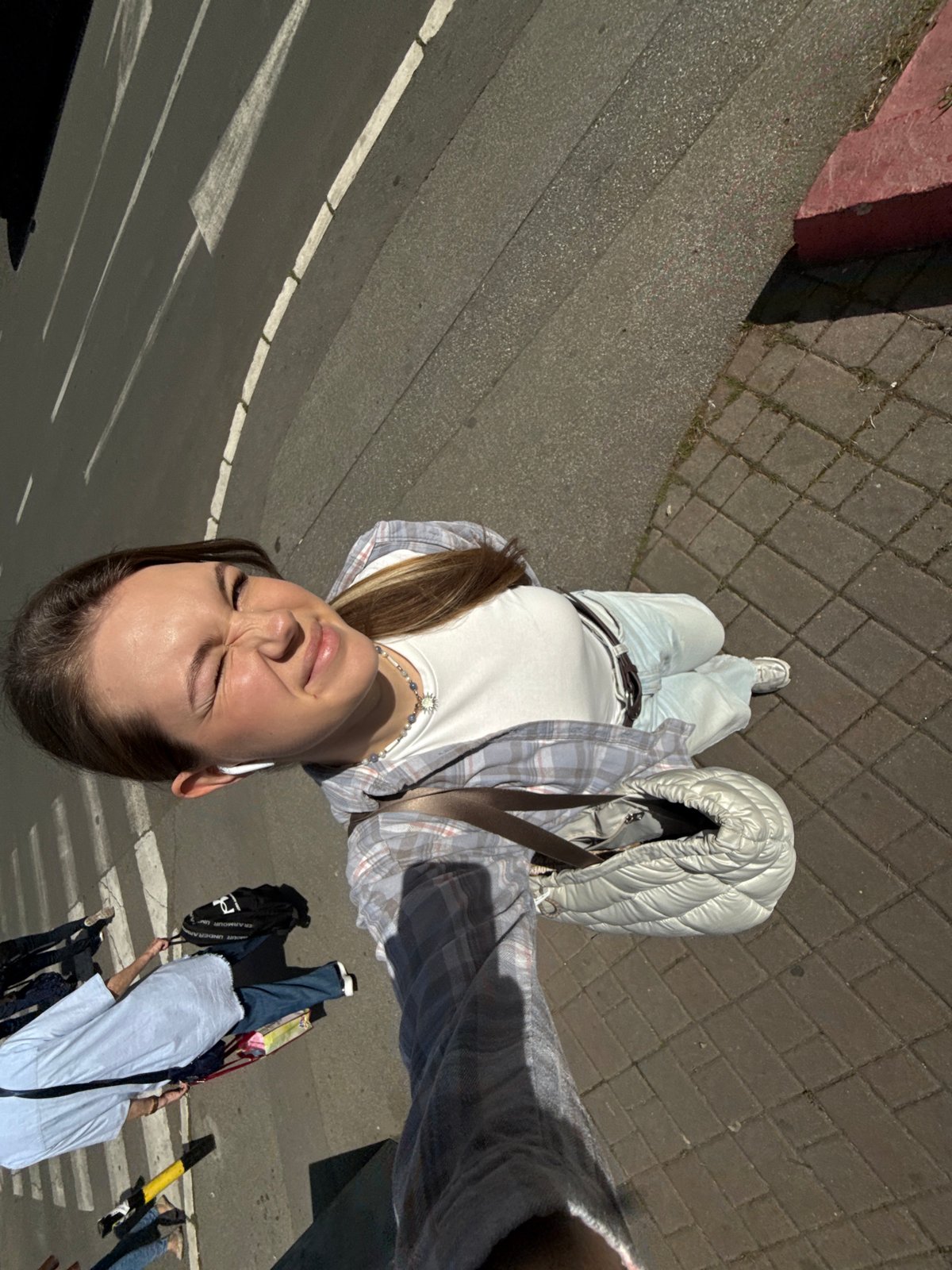 Woman Takes Selfie on Belgrade Street Sidewalk