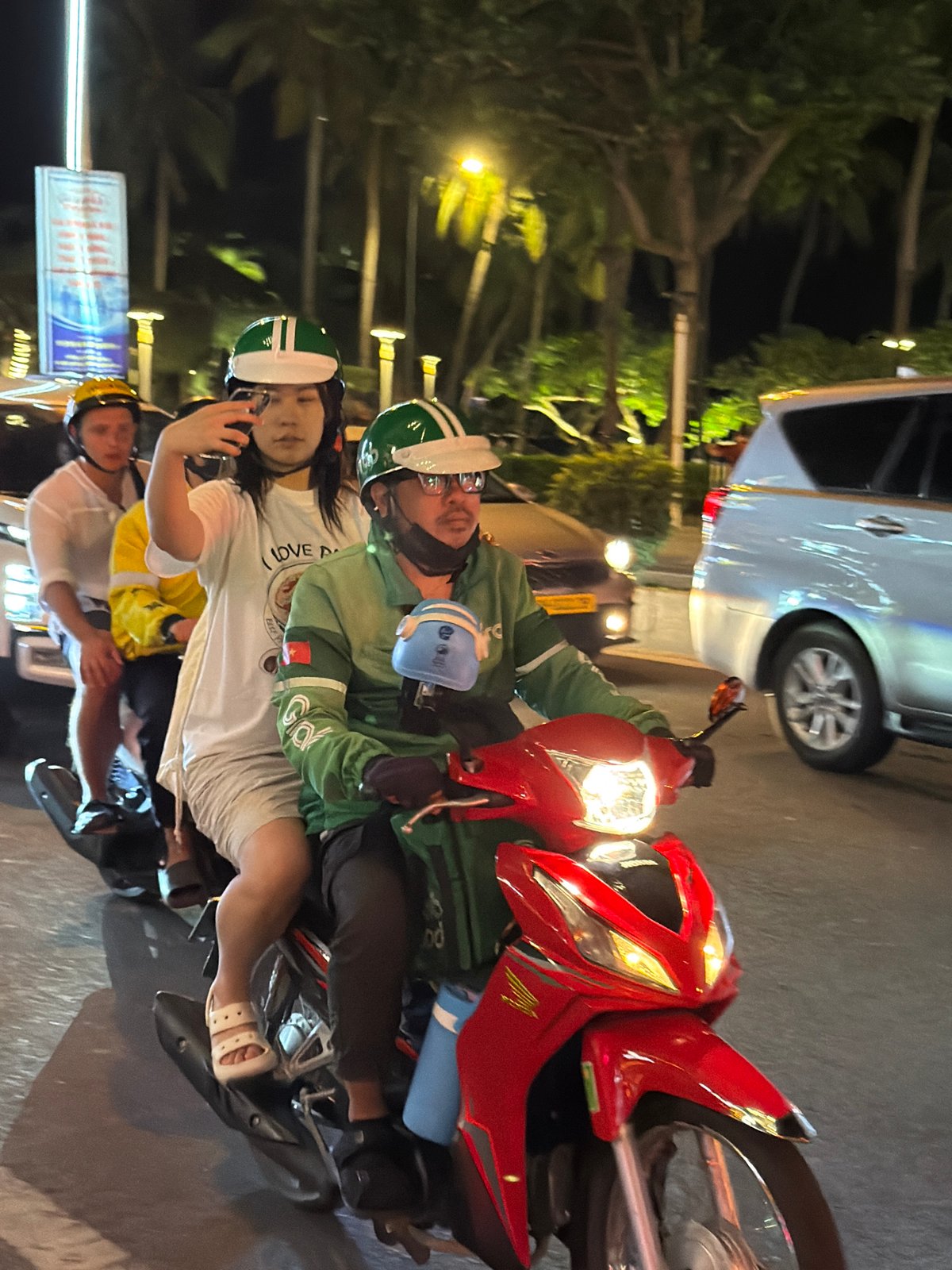 Nha Trang nightlife strip buzzing with traffic, clubs, and scooters