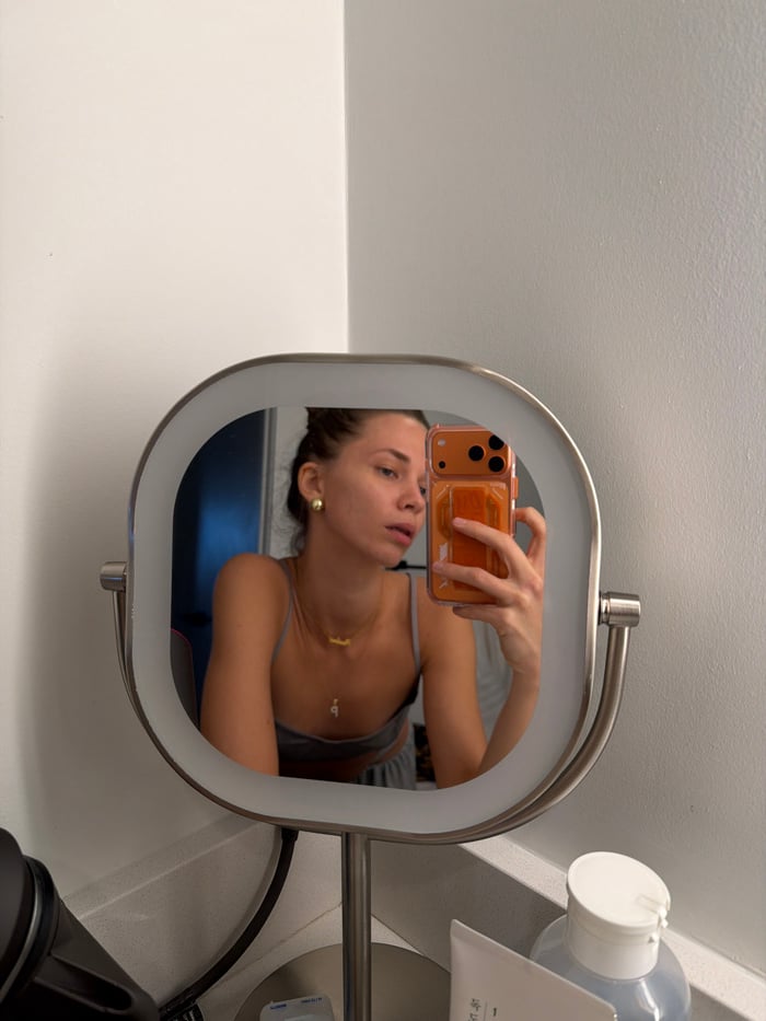 Woman takes mirror selfies in Fort Lauderdale evening