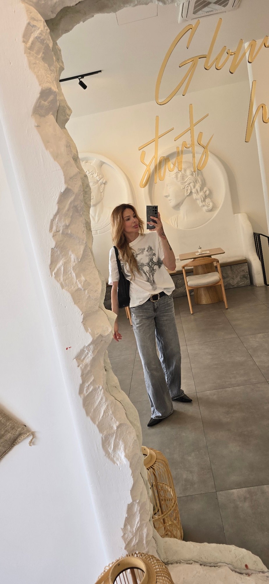 Woman takes selfies at Podgorica cafe during lunch hour