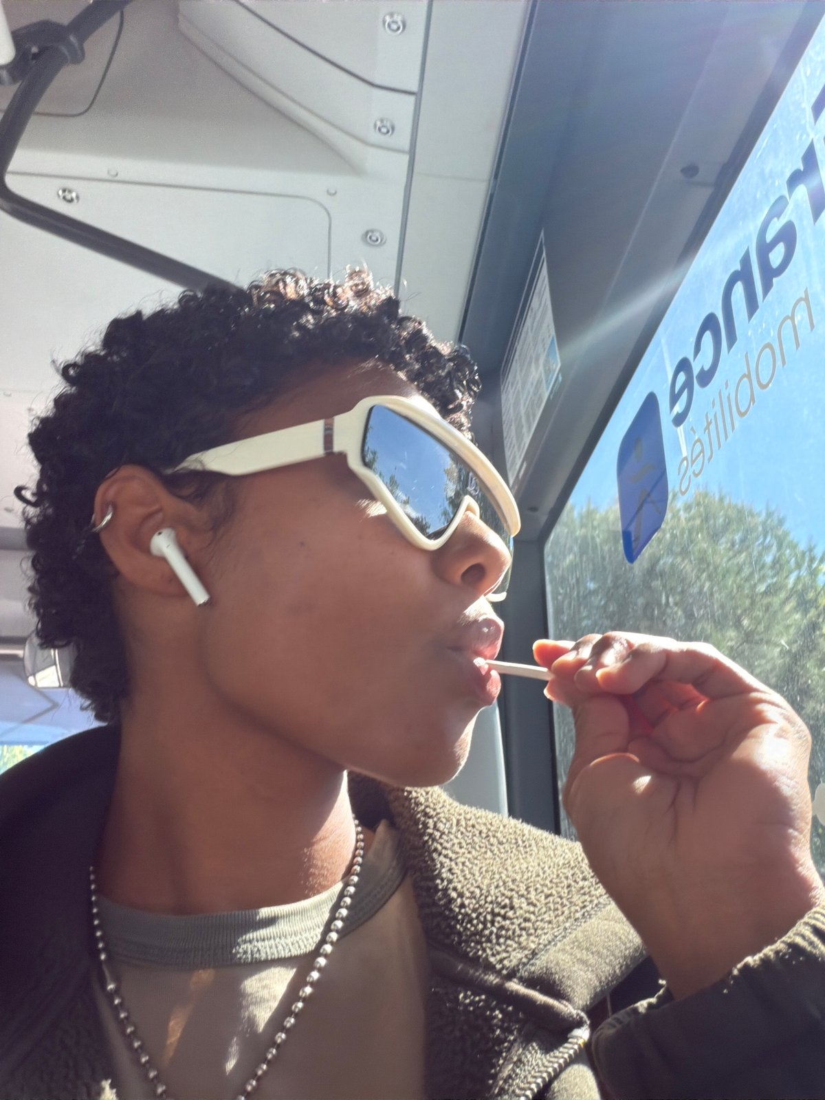 Person in white sunglasses observed on public transport in France