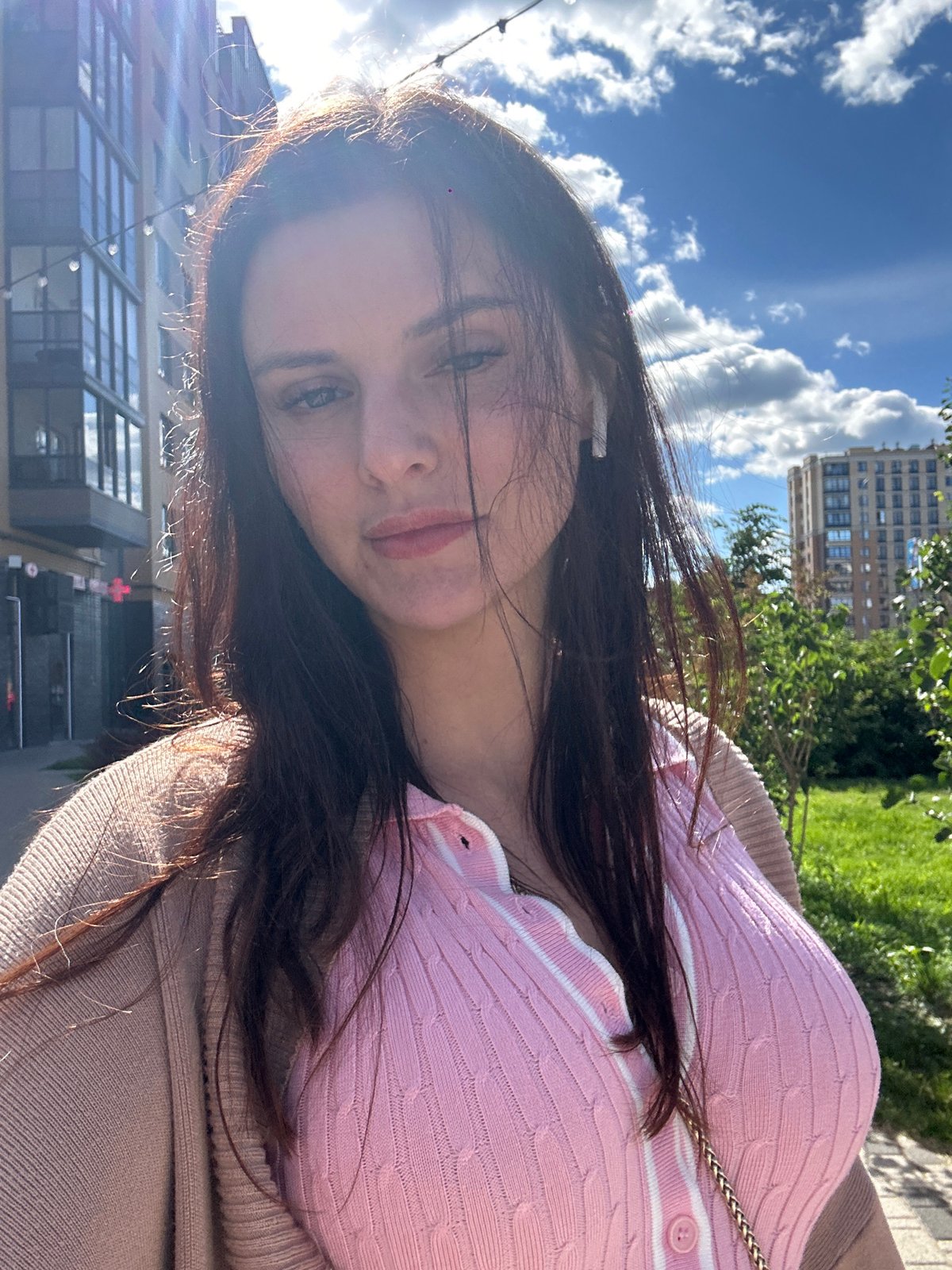Out and about in a Russian-speaking city, pink knit in tow