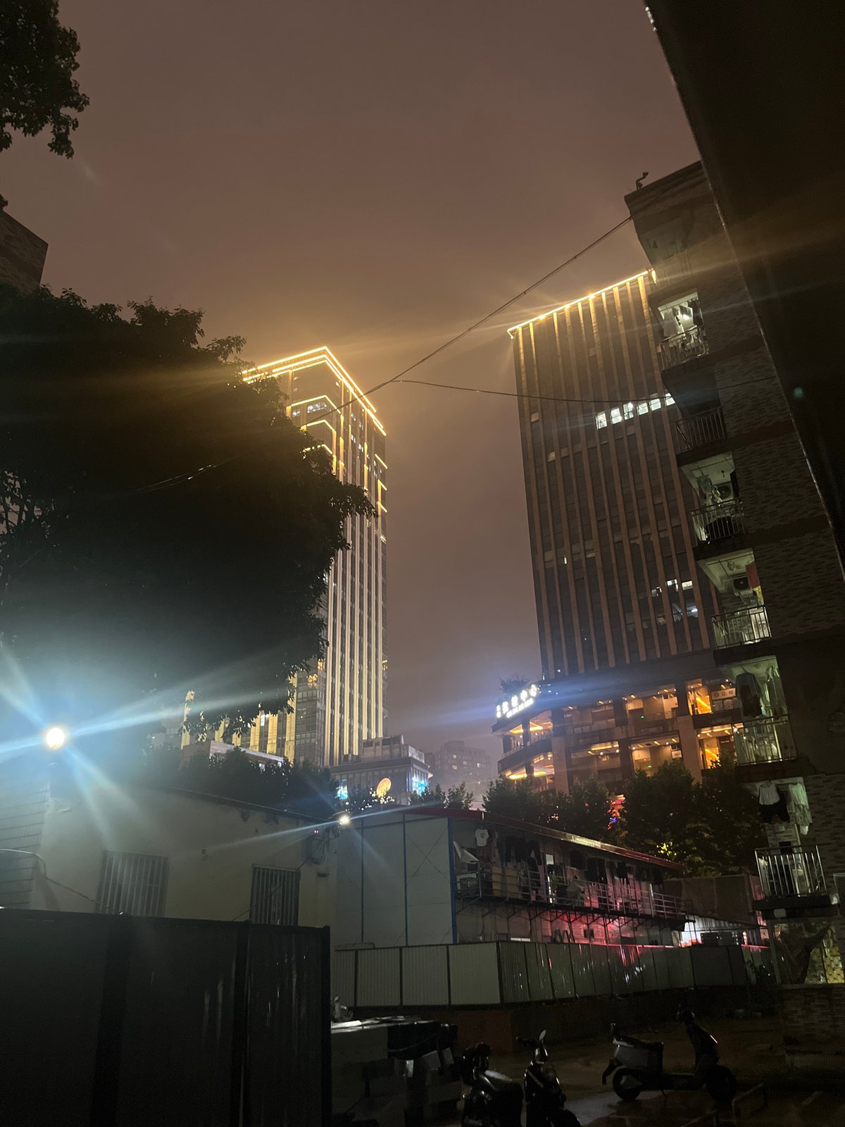 Nighttime urban scenes documented in rainy Yuzhong District, China
