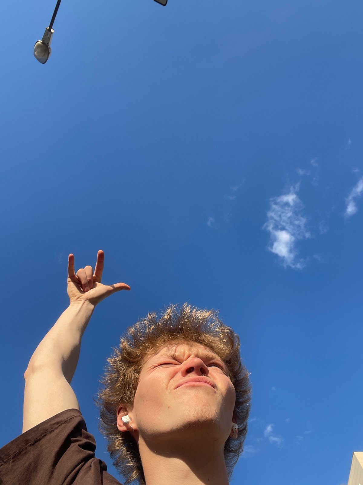 Person photographed making casual poses in Krasnoyarsk