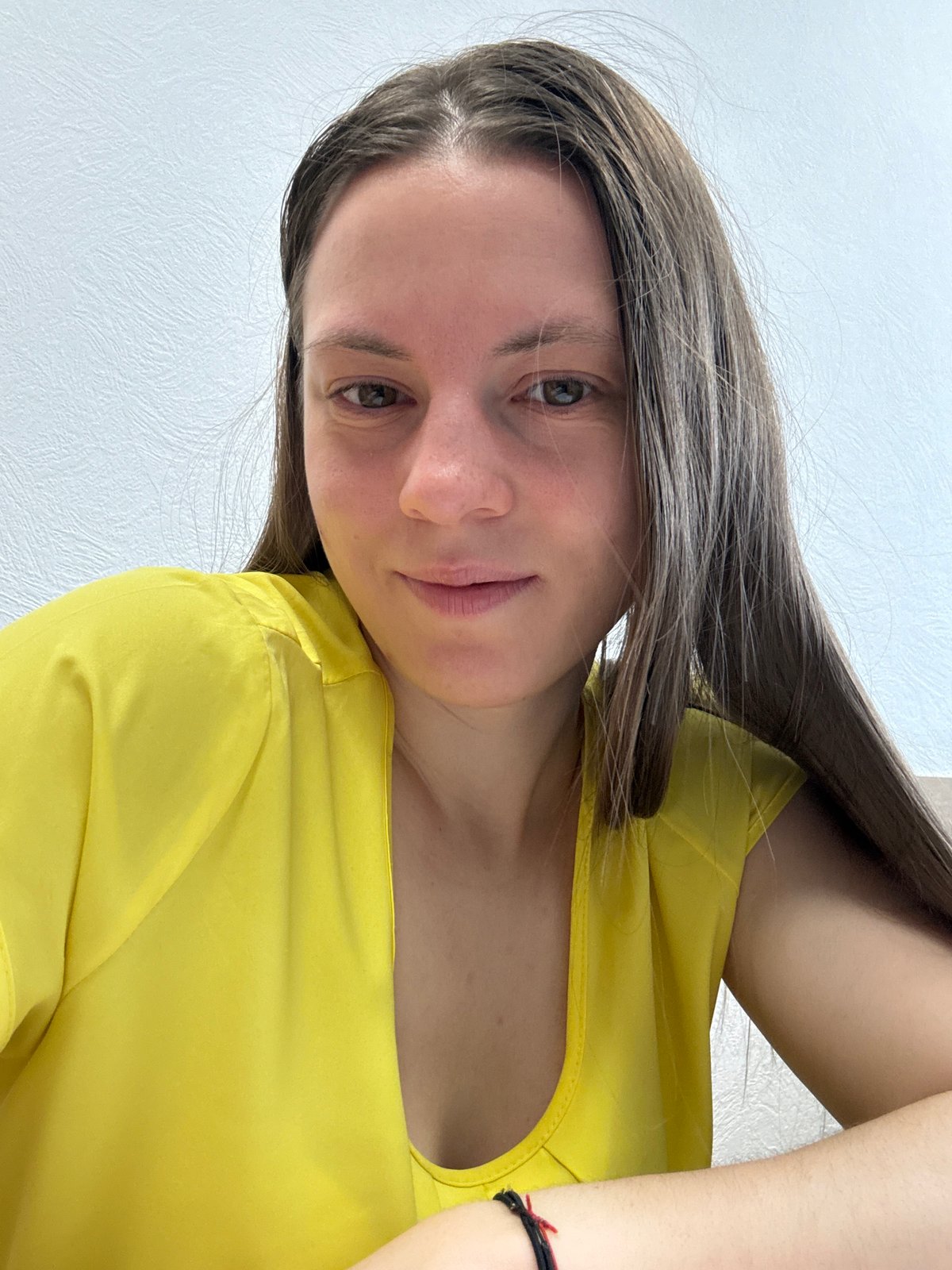 Woman photographed multiple times indoors in Chaikovsky, Russia