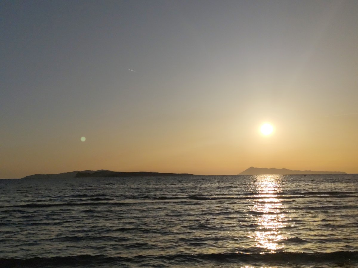 Coastal sunset and beach activities documented by witnesses