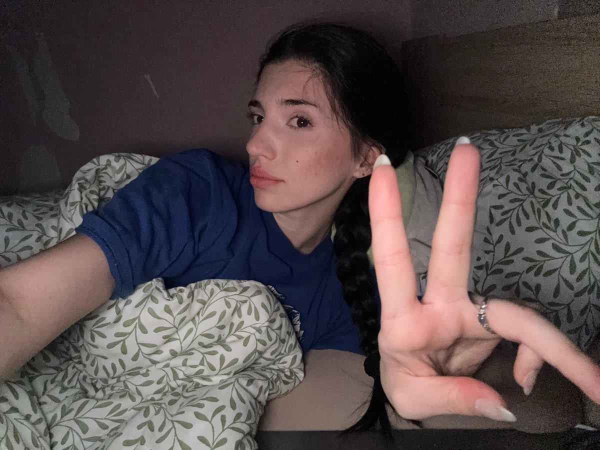 Woman rests in bed during late evening hours in Sofia