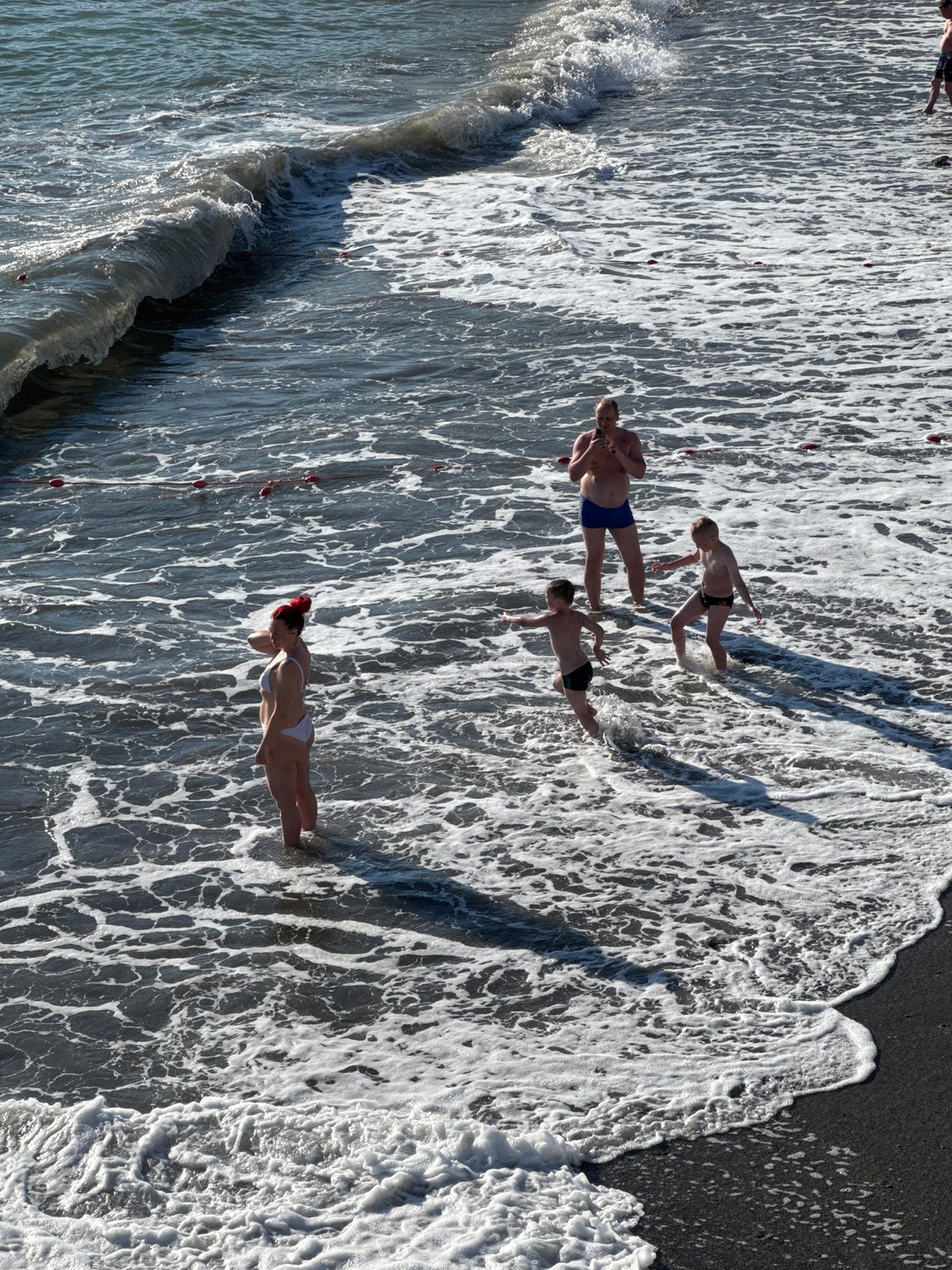 Sunny afternoon beach scenes across Sochi's Black Sea coast
