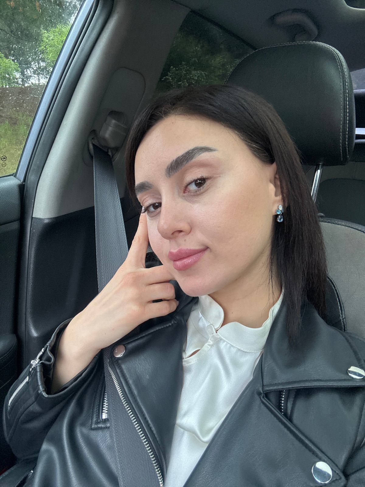 Woman Takes Selfies in Car During Tbilisi Traffic